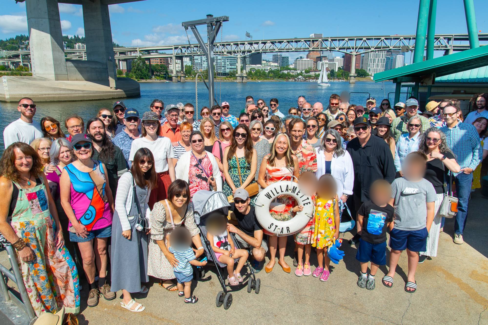 Dill Ward Group clients and their families at a client appreciation party on the Willamette River in Portland